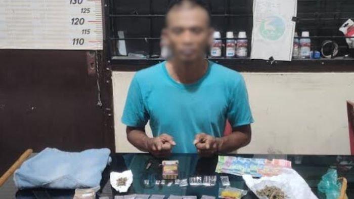 PENGEDAR— Pelaku J (41) yang diduga sebagai pengedar sabu dan ganja ditangkap jajaran Satresnarkoba Polres Payakumbuh.